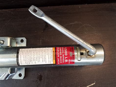 Use two half-inch box end wrenches to remove the half-inch bolt and nut. . Haul master trailer jack parts